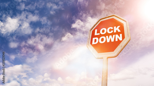 Lockdown word on stop sign, corona virus pandemic buzwword headline