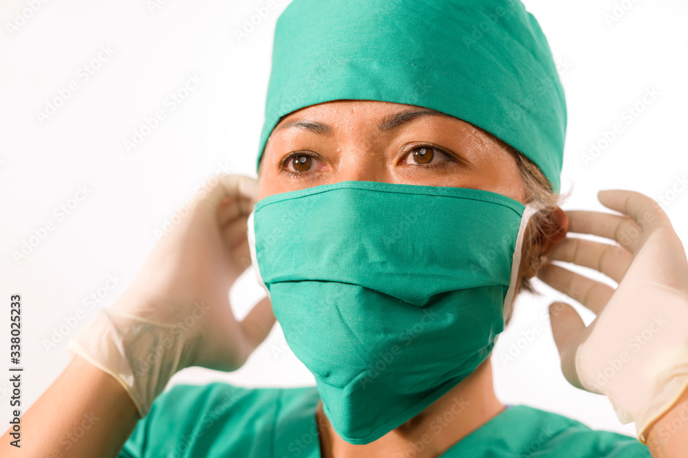 closeup portrait of mature attractive and happy medicine doctor woman or hospital nurse in medical scrubs latex gloves and mask confident closeup portrait of mature attractive and happy medicine doctor woman or hospital nurse in medical scrubs latex gloves and mask confident