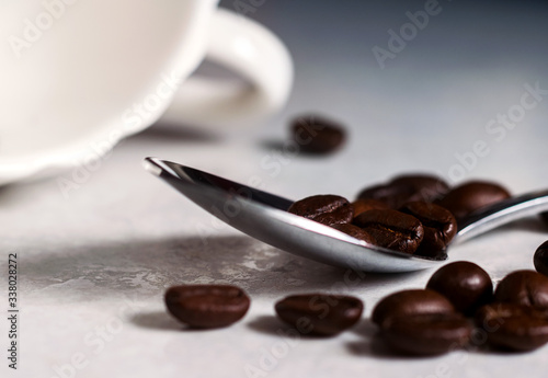 Coffee beans and a white Cup
