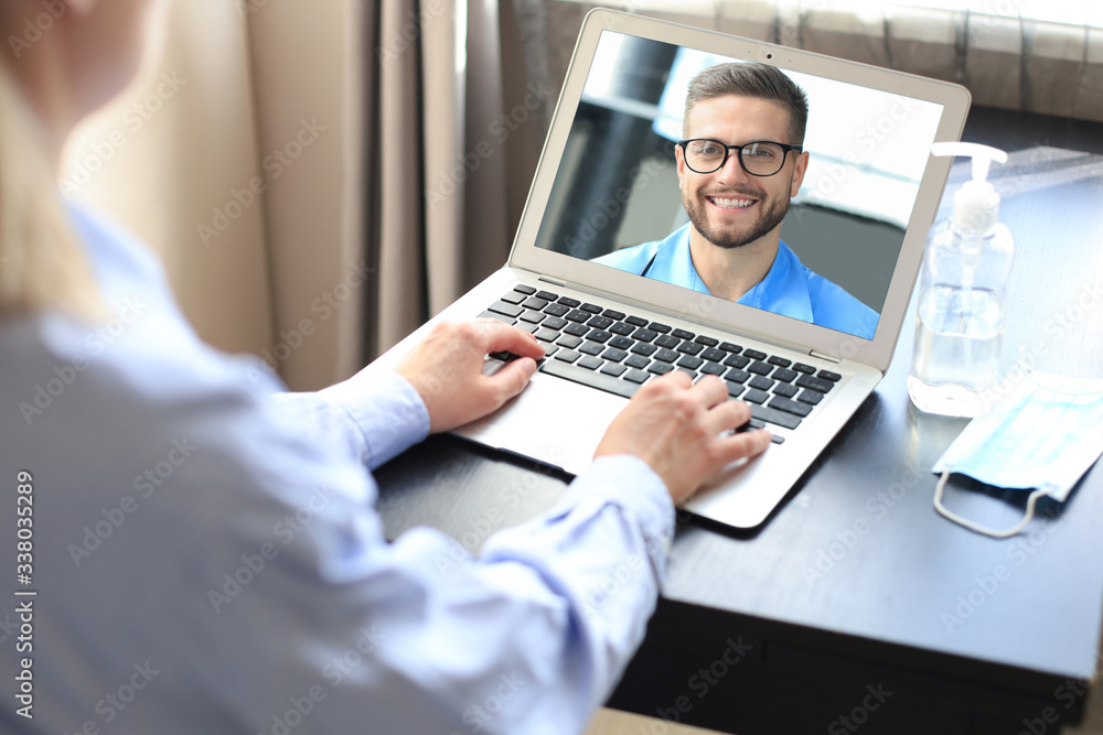 Young woman doing video conference with doctor on laptop. Coronavirus. Young woman doing video conference with doctor on laptop. Coronavirus.