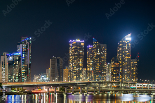 The night view of skyscraper in Haeundae and Gwangan Bridge, Busan, South Korea © J. studio