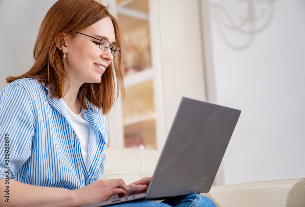 freelancer woman working at computer in apartment freelancer woman working at computer in apartment