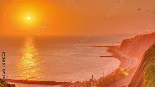 Aerial sunset view of Lima's Coastline in the neighborhood of Miraflores timelapse, Lima, Peru © neiezhmakov