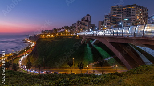 Villena Bridge with traffic and partial City view in the Background day to night timelapse, Lima, Peru. photo