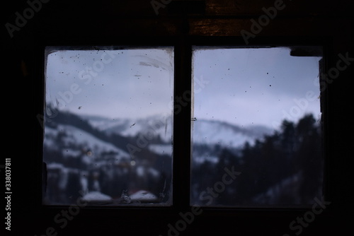 View of mountain landscape from window inside Brans castle in Bran Romania