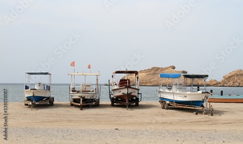 Lonely ships waiting for turists on the beach. Sultanate of Oman, photo taken on  April  4th, 2019, north coast. © svehlik