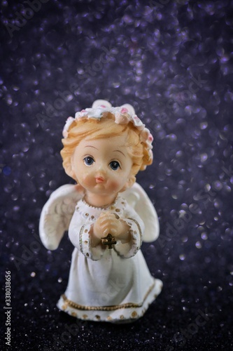 figurine angel with wings on a black background