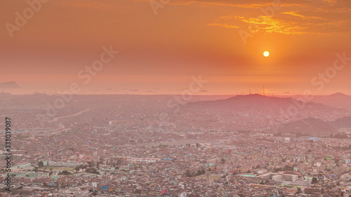 Aerial sunset view of Lima skyline timelapse from San Cristobal hill.