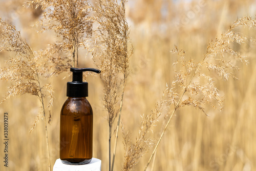 Soap or lotion in glass bottle with dispenser