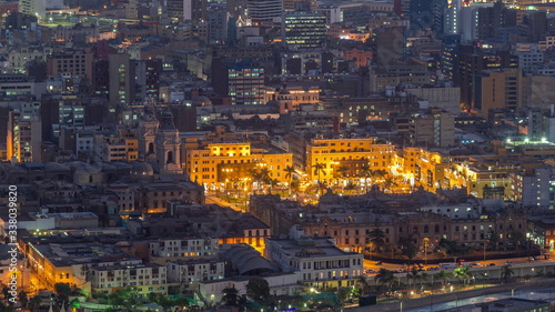 Aerial top view of Lima main square from San Cristobal hill day to night timelapse, government palace of Peru and cathedral church. © neiezhmakov