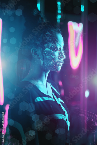 Asian woman with face ID concept in neon light photo