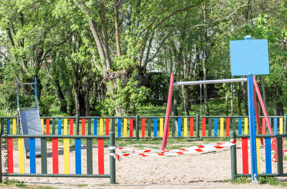Playground sealed by the police during the state of alarm in Spain, to avoid its use while the quarantine lasts, coronavirus, covid19, selective focus