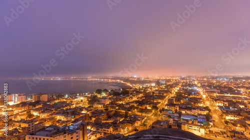 Panoramic skyline of Lima city from above with many buildings aerial night to day transition timelapse. Lima, Peru © neiezhmakov