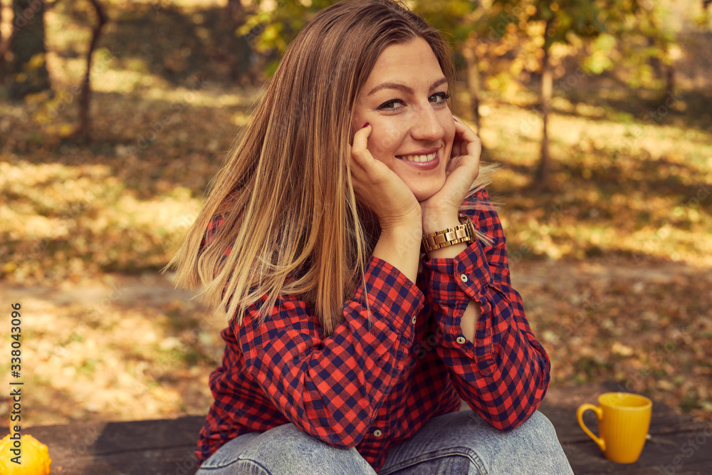 Portrait of beautiful woman enjoying and posing in autumn day. Portrait of beautiful woman enjoying and posing in autumn day.
