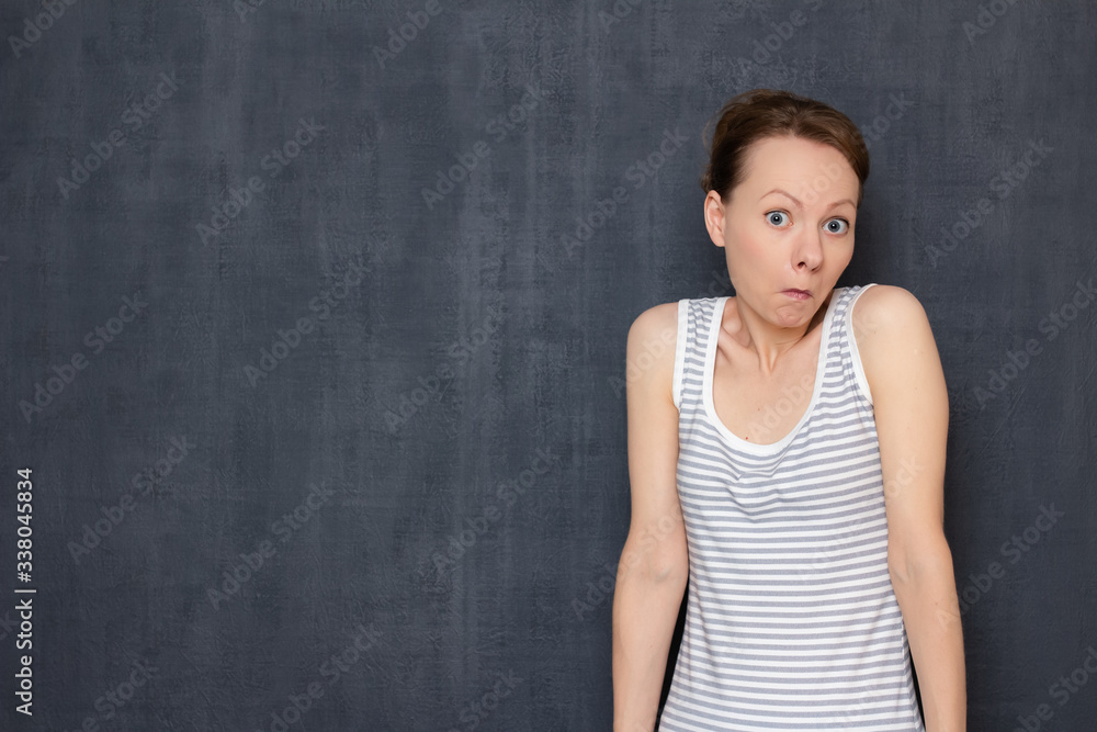 Portrait of perplexed bewildered girl shrugging shoulders Portrait of perplexed bewildered girl shrugging shoulders