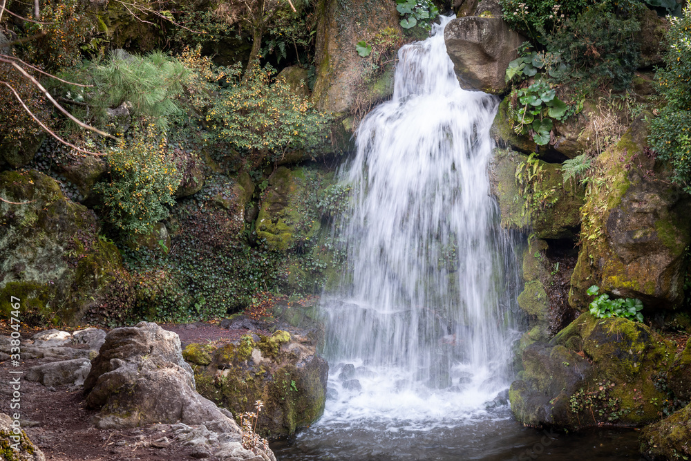 Fototapeta premium A small waterfall from a trip to Jeju Island, South Korea.