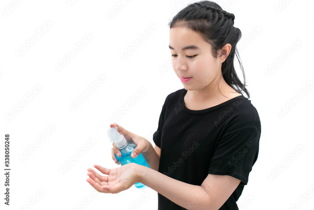 Girl in medical mask cleans hands with antiseptic or alcohol cleansing gel with Do not let virus spread concept. Girl in medical mask cleans hands with antiseptic or alcohol cleansing gel with Do not let virus spread concept.