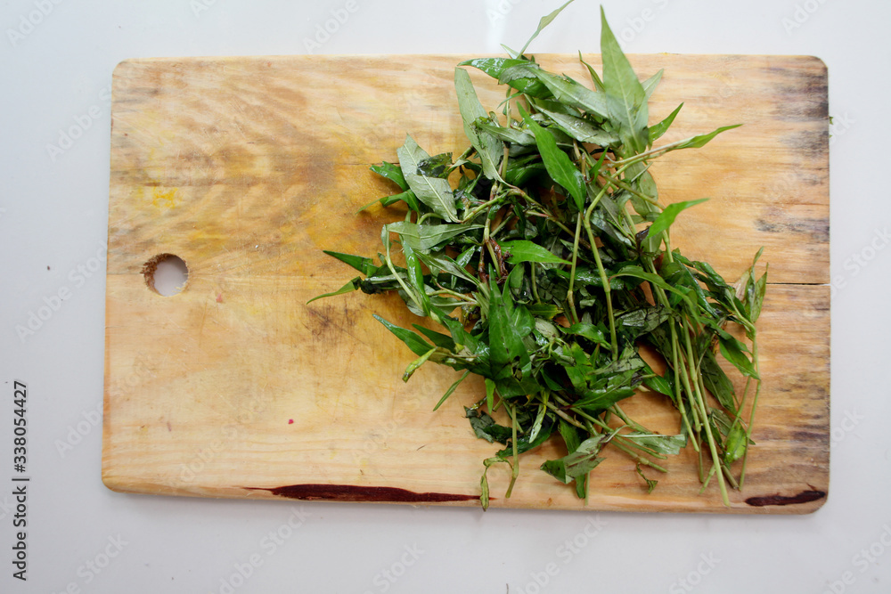 Vietnamese mint with wooden cutting board, also known as Vietnamese mint with wooden cutting board, also known as