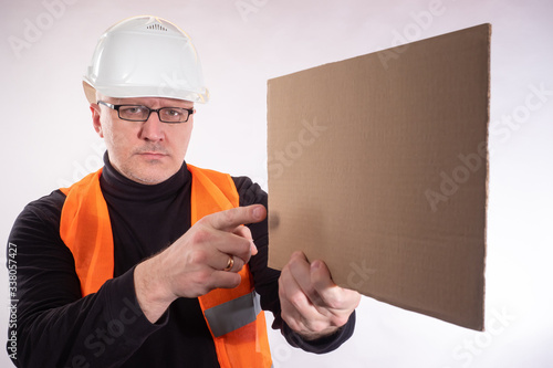 Man holds a home-made banne...