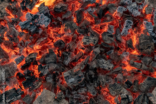 Hot coals in a bonfire.