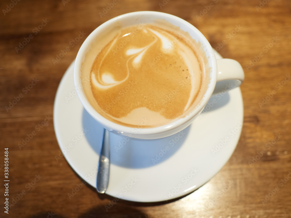 A cup of latte with some latte art