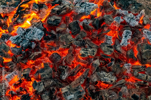 Hot coals in a bonfire.