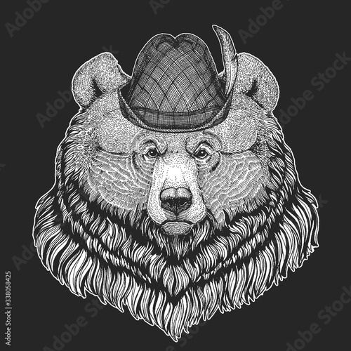 Grizzly bear. Oktoberfest. Tirol traditional hat. Beer festival. Portrait of wild animal.