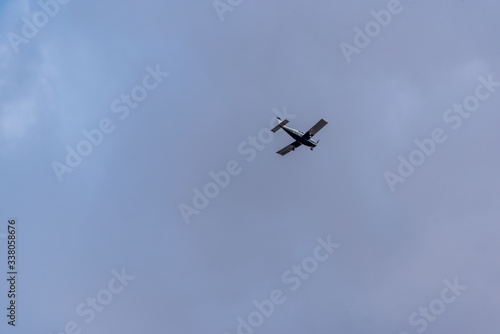 Small Private Prop Plane Flying in the Sky