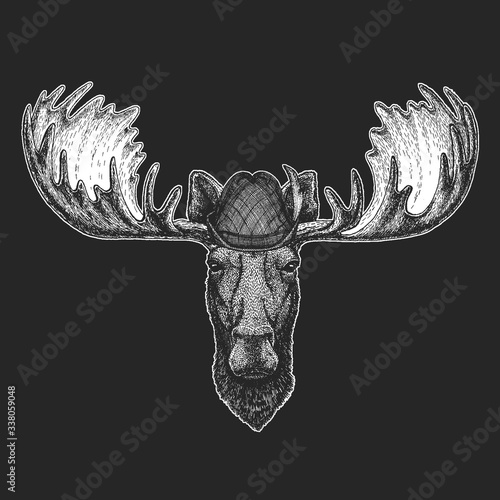 Moose head. Oktoberfest. Tirol traditional hat. Beer festival. Portrait of funny animal.