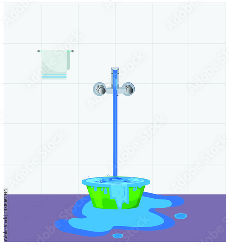 Water waste from running tap. Water overflow on bucket and spread on floor. Wastage of water theme in bathroom.