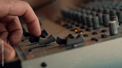 Sound Engineer Moving Sliders In Radio Station.Soundboard Pads On TV Station.Engineer Press Key Buttons On Control Desk Recording Studio.Sound Designer Used Digital Audio Mixer In Production Studio