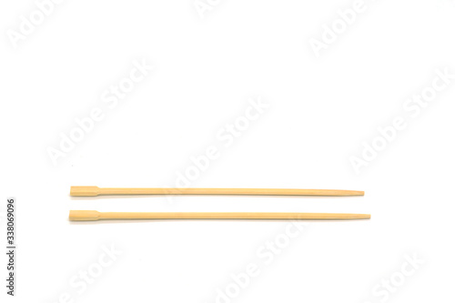 disposable beech wooden chopsticks isolated on white background. Copy space