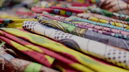 A close up shot of the colourful, traditional African fabric for sale at a crafts market in the Maboneng district of Johannesburg, South Africa. photo