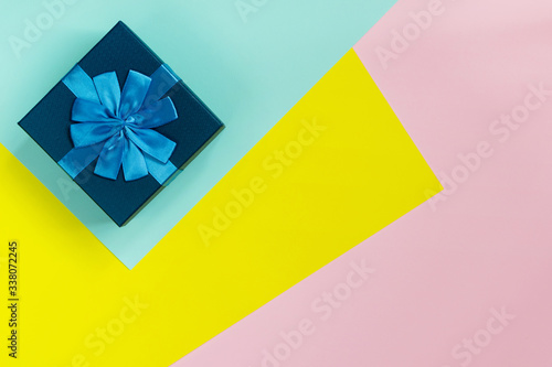 Happy Father's day greeting card with decorated gift box on colorful background. Top view. © mayanko