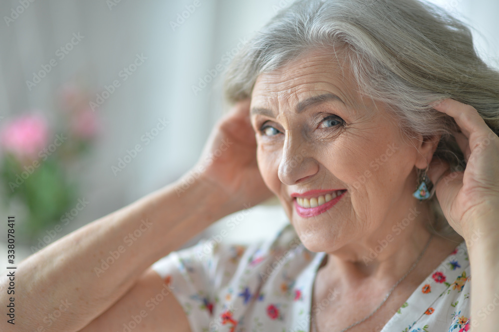 Portrait of happy senior woman posing at home Portrait of happy senior woman posing at home