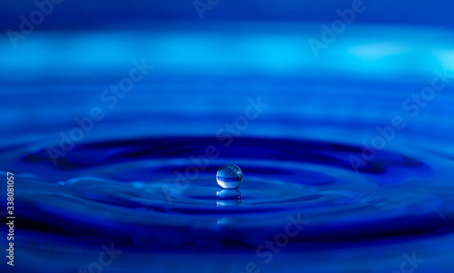 A Water Drop Resting on the Water Surface Before Breaking the Tension
