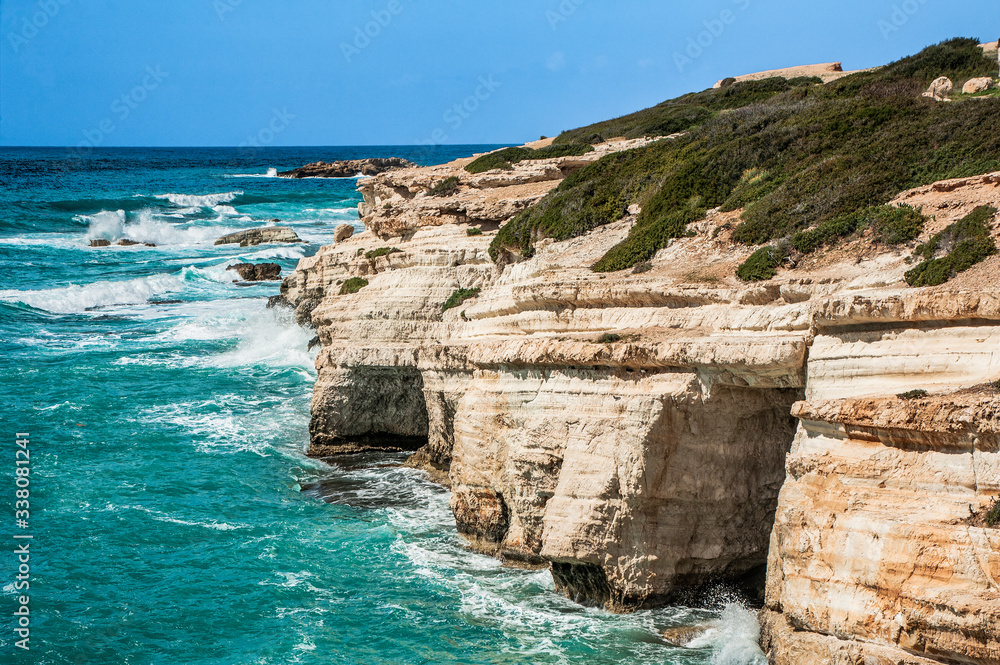 A fresh spring wind drives the waves to the coast of Cyprus. The Mediterranean Sea is painted with dark ultramarine and a luminous azure from the inside. A fresh spring wind drives the waves to the coast of Cyprus. The Mediterranean Sea is painted with dark ultramarine and a luminous azure from the inside.