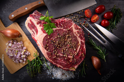 Raw T Bone steak entrecote prepared to Grill on turntable