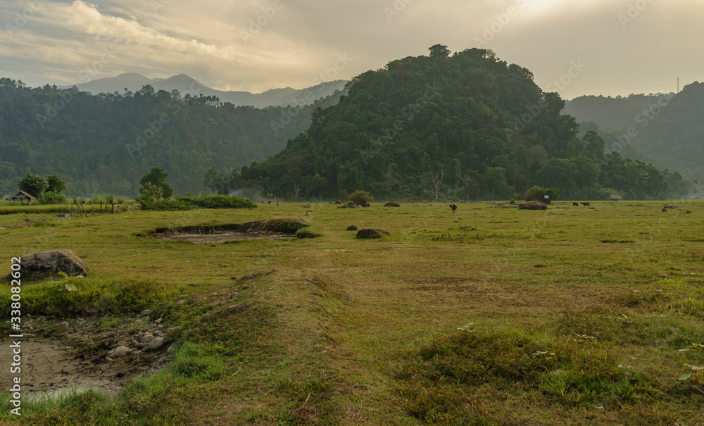 Nature scene farmers land near Rajabasa volcano mountain seen on a cloudy or hazy day near Kalianda