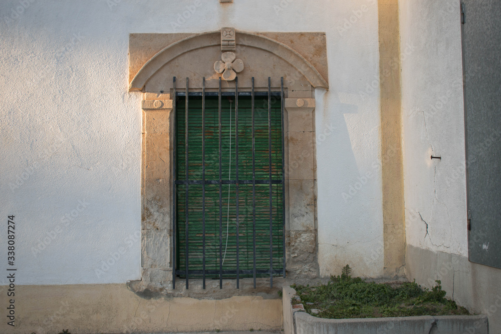 Obraz premium old wooden window in old town
