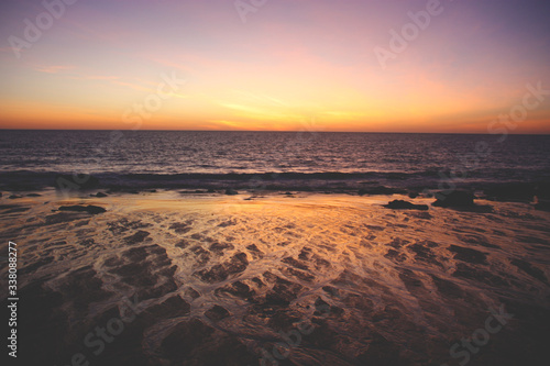Sunset on beach with water zigzag