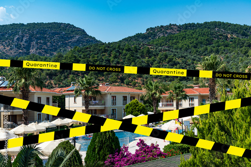 Barrier tape - quarantine, isolation, entry ban. Do not cross. Holiday vacation hotel pool