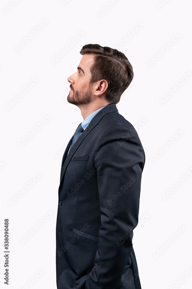 Businessman standing looking away to future perspectives isolated on white background. Businessman standing looking away to future perspectives isolated on white background.
