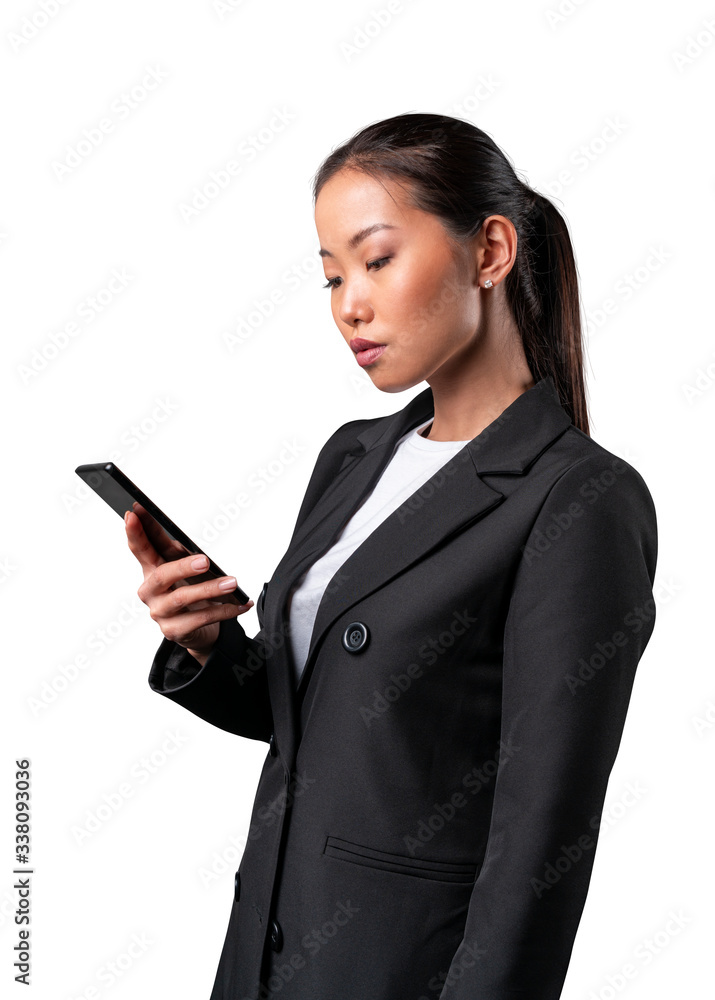 Asian woman in suit looking at mobile phone and texting. Isolated on white background. Asian woman in suit looking at mobile phone and texting. Isolated on white background.