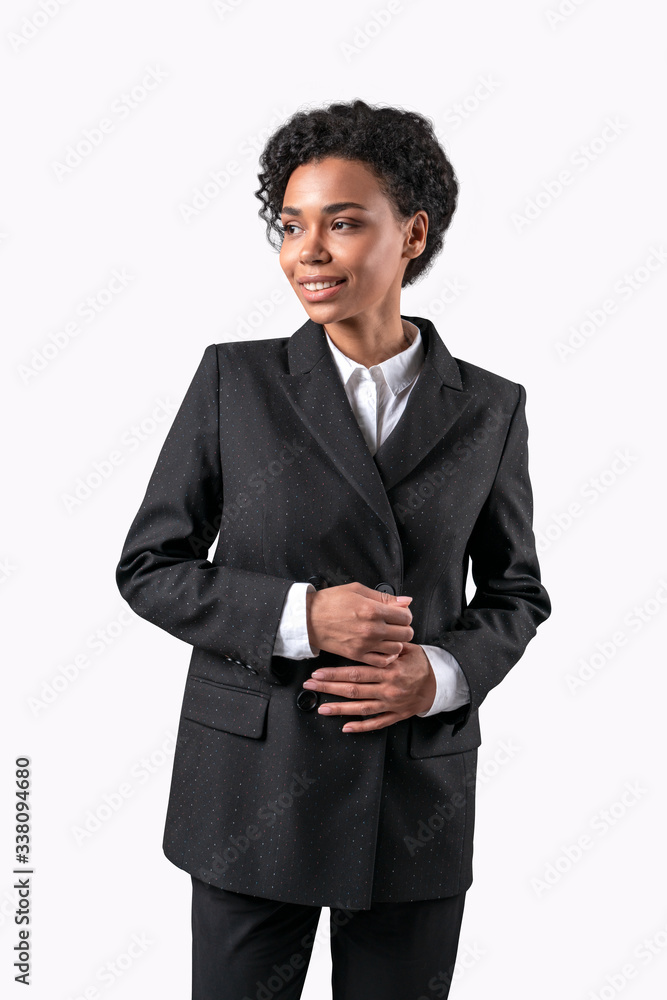 Businesswoman isolated on white background. Young smiling african business woman standing formal suit. Businesswoman isolated on white background. Young smiling african business woman standing formal suit.