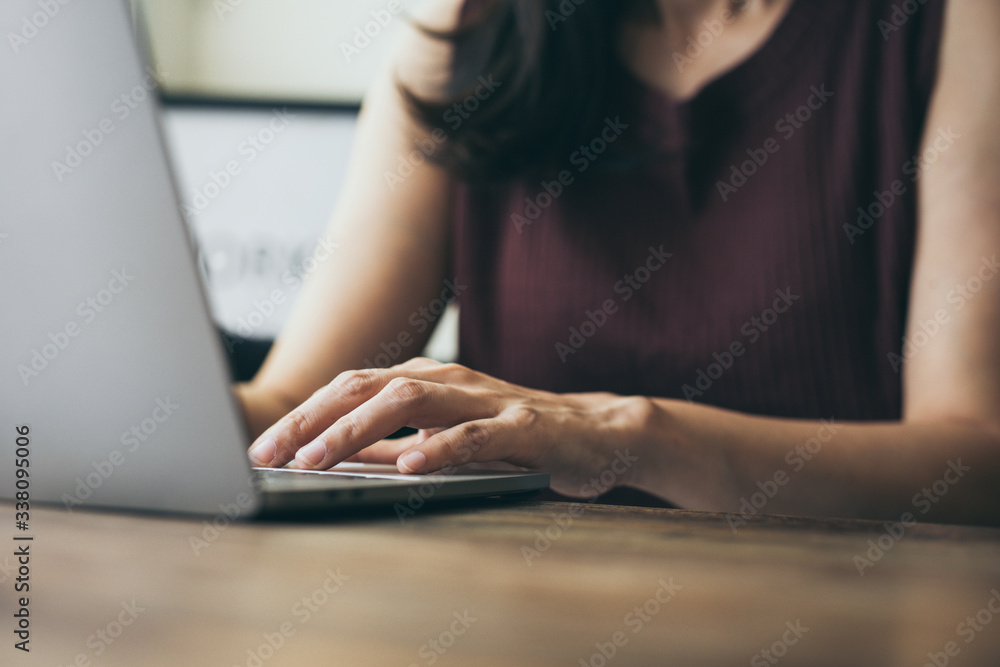 Naklejka premium work from home.using computer.hand typing keyboard laptop online chatting search form internet while working sitting on sofa.concept for technology device contact communication business people