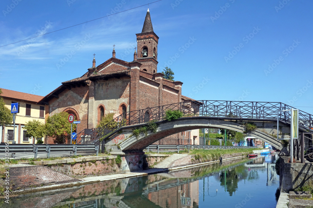Naklejka premium Italy , Milan - San Cristoforo church in Navigli Canals ( Naviglio Pavese ) Downtown of the city empty of people during n-cov19 Coronavirus outbreak epidemic quarantine home