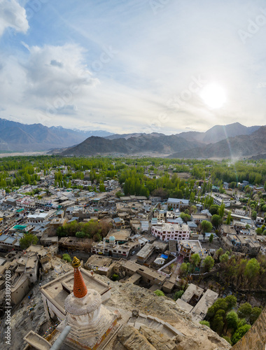 The city of Leh, seen from the top of the citadel, in the fertile valley niched in the Himalaya mountains, Ladakh, India photo