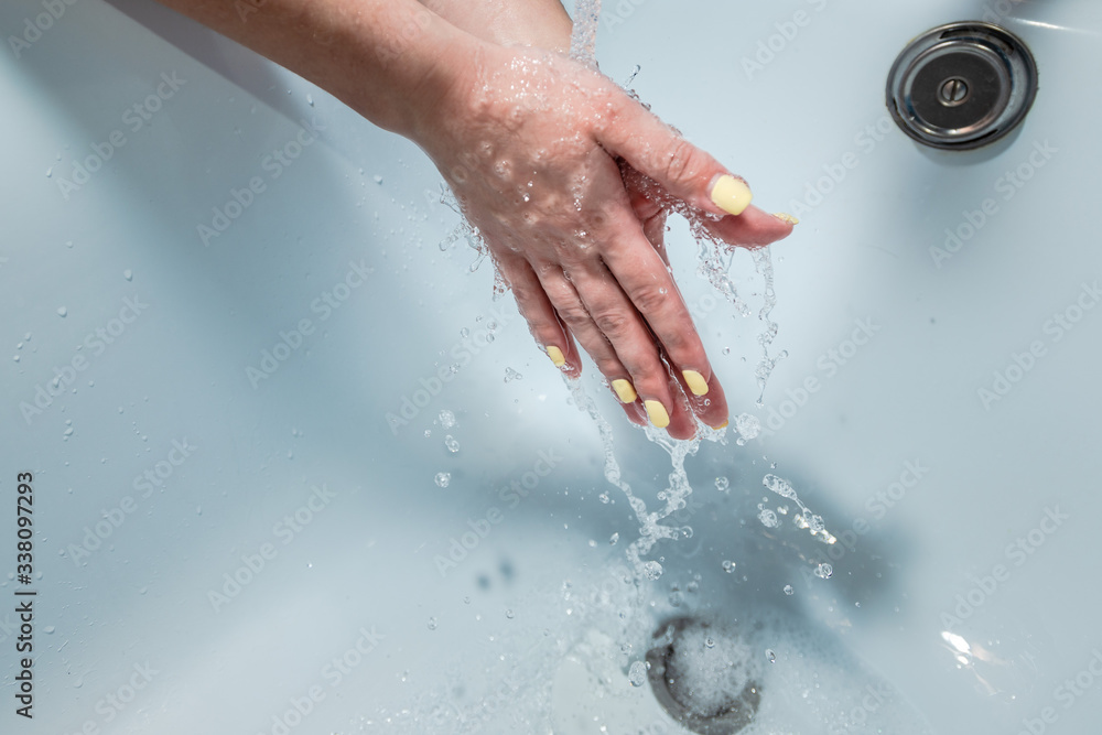 Fototapeta premium Coronavirus pandemic prevention wash hands with soap warm water