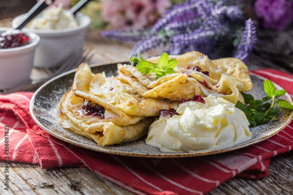 Crepes with ricotta cheese and blackcurrant jam. Crepes with ricotta cheese and blackcurrant jam.